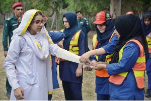 In view of the Indian aggression and current security situation, Civil Defense and Rescue teams conduct a mock emergency drill for female students at Government Comprehensive Girls High School in Madina Town