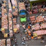 Wholesale fruit vendors deal with customers and their suppliers at fruit market in the Provincial Capital