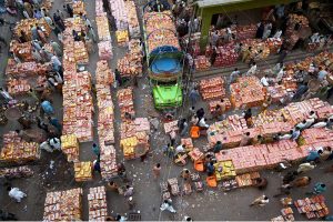 Wholesale fruit vendors deal with customers and their suppliers at fruit market in the Provincial Capital