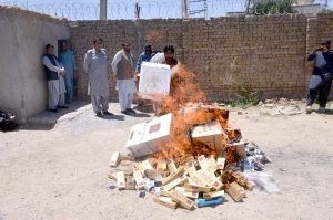 FBR personnel torch illegal Platinum cigarettes recovered during a checking operation