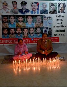 Convener of the World Minorities Alliance, J. Salik, along with his wife, lighting candles to show solidarity as the nation observed Youm-i-Tashakur on Friday across the country to honour the armed forces and the people for their victory in Operation Bunyan-um-Marsoos against India