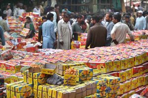 Wholesale fruit vendors deal with customers and their suppliers at fruit market in the Provincial Capital
