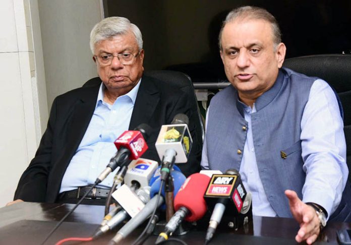 Federal Minister for Communications Aleem Khan speaks to media after a meeting with the business community at Arif Habib Centre