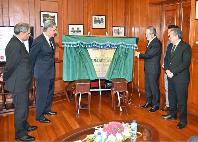 Hon'ble Mr. Justice Jamal Khan Mandokhail, Chairman Building Committee performing ground breaking ceremony of 