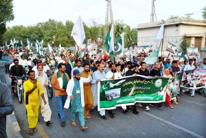 A large number of people participate in a rally organized to celebrate Thanksgiving Day, expressing solidarity with the Pakistan Armed Forces following the successful military operation 'Bunyan Marsous' against India.