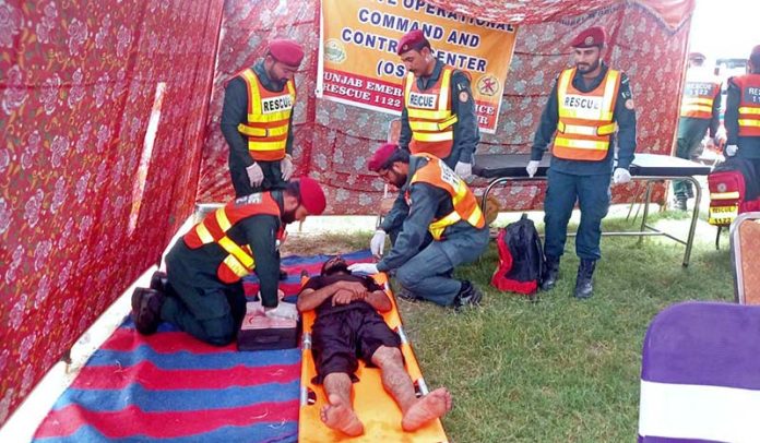 Rescue 1122 personnel conduct a mock drill as part of preparations for the upcoming monsoon and potential flood situations on the Shashmai Canal