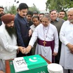 Governor KP Faisal Kareem kundi cutting victory cake with minorities during a rally to celebrate Thanksgiving Day, expressing solidarity with the Pakistan Armed Forces following the successful military operation ‘Bunyan Marsous’ against India from Governor house to Press Club