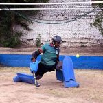 A goalkeeper in full action during a friendly hockey match between Ali Amir Hockey Club and Mujahid Zafar Hockey Academy