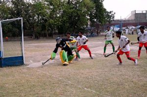 A goalkeeper in full action during a friendly hockey match between Ali Amir Hockey Club and Mujahid Zafar Hockey Academy