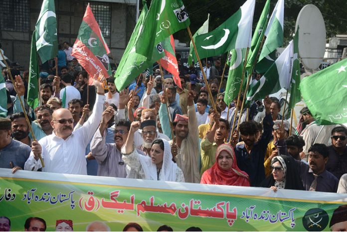 Activist of Pakistan Muslim League Q holding a protest rally against Indian attacks on Pakistani cities outside Karachi Press Club