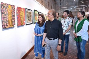 Visitor girls observe and admire a masterpiece of art on display at the NCA Art Gallery, Anarkali