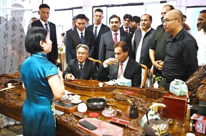 Speaker of the National Assembly of Pakistan Sardar Ayaz Sadiq and Chinese Ambassador to Pakistan, Jiang Zaidong experiencing Hanfu try-on tea ceremony during the event ‘Celebrating the 74th Anniversary of the Establishment of Diplomatic Relations between China and Islamic Republic of Pakistan 1951-2025 at Silk Road Culture Center Sir Syed Memorial Building