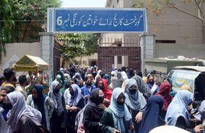 Students coming out of Women Girls College Korangi after appearing in their Intermediate examinations