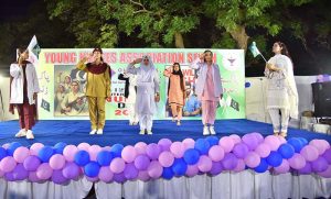 Girls performing in a tableau to pay tribute to Pakistan Armed Forces during function in connection with International Nurses Day celebrations at Press Club.