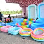 A vendor displaying the water pools to attract the customers for selling under the fly over at Qasimabad