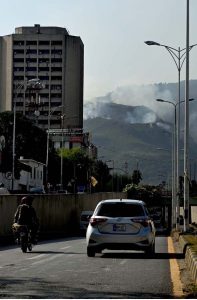 A view of smoke emitting after fire erupts at Margalla Hills in the Federal Capital