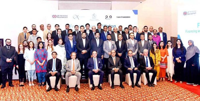 Senator Muhammad Aurangzeb, Federal Minister for Finance & Revenue, in a group photo with the organizers and participants of the Impact Financing event organized by Karandaaz Pakistan and Pakistan Banks Association (PBA)