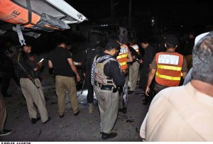 Police officials collecting evidence from the spot after suicide bomb blast on police van near Ring Road, Cattle Market, resulting 2 police officials dead and 1 injured in this incident.