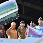 Prime Minister Muhammad Shehbaz Sharif celebrates Pakistan's victory in Maarka-e-Haq, with the officers of Pakistan Air Force at the Kamra Aeronautical Complex