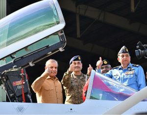 Prime Minister Muhammad Shehbaz Sharif celebrates Pakistan's victory in Maarka-e-Haq, with the officers of Pakistan Air Force at the Kamra Aeronautical Complex