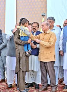 Prime Minister Muhammad Shehbaz Sharif distributing relief cheques amongst the families of martyred during Ma’arka-e-Haq