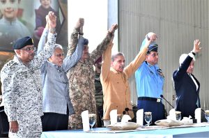 Prime Minister Muhammad Shehbaz Sharif celebrates Pakistan's victory in Maarka-e-Haq, with the officers of Pakistan Air Force at the Kamra Aeronautical Complex