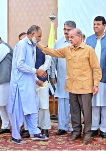 Prime Minister Muhammad Shehbaz Sharif distributing relief cheques amongst the families of martyred during Ma’arka-e-Haq