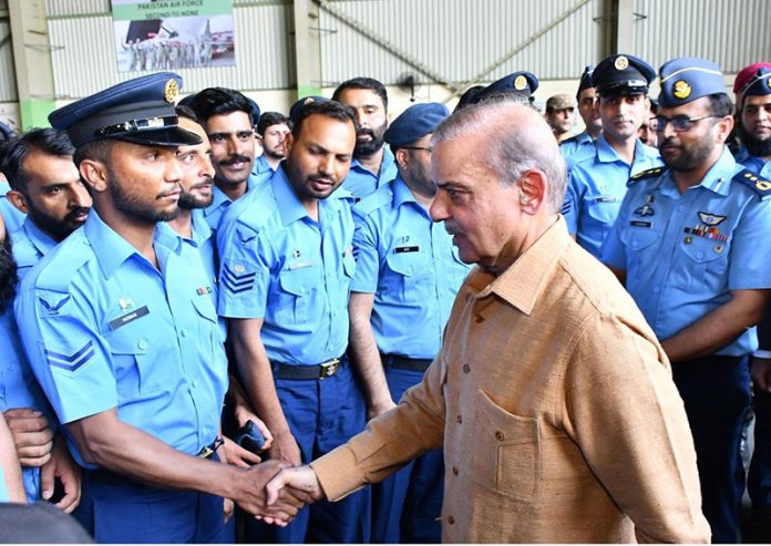 Prime Minister Muhammad Shehbaz Sharif interacts with officers at the Kamra Aeronautical Complex