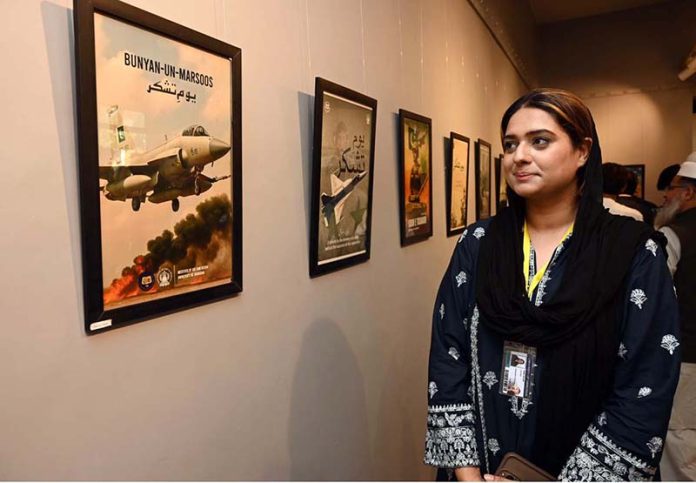 Students are vesting the photo exhibition after inaugurating on the occasion of Thanks giving Day (youm-E-tshakur) organized by the Fine Arts Department University of Sargodha