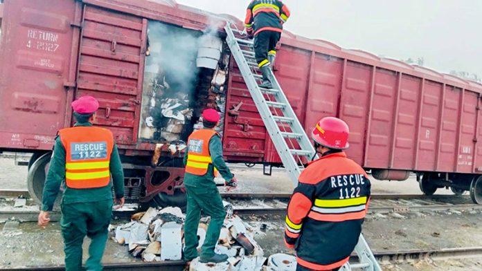 Rescue 1122 workers trying to extinguish fire that broke out on a freight train at Sama Satta Railway Station
