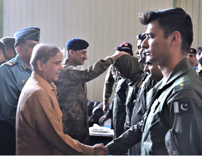 Prime Minister Muhammad Shehbaz Sharif interacts with officers at the Kamra Aeronautical Complex