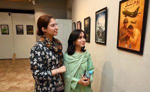 Students are vesting the photo exhibition after inaugurating on the occasion of Thanks giving Day (youm-E-tshakur) organized by the Fine Arts Department University of Sargodha