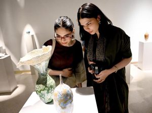 Visitors viewing 'Bowl Works' during the exhibition This is Not a Bowl by Sulaman Ikram, curated by Aasim Akhtar, at Khaas Gallery, IFWA