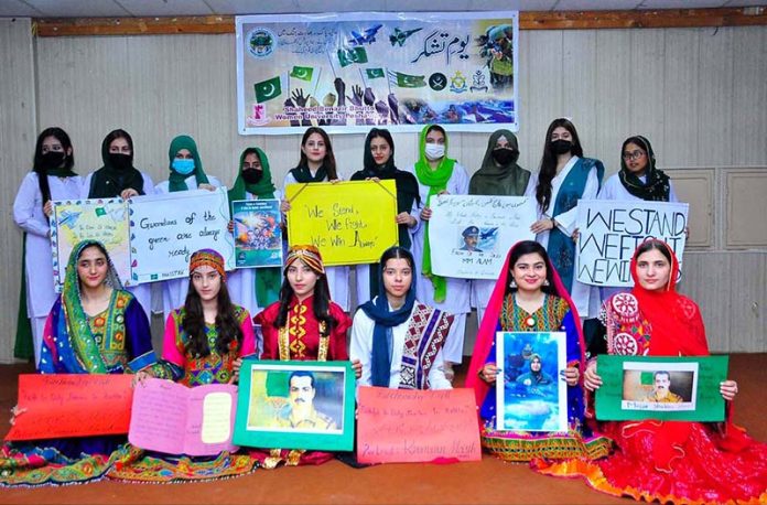 SBBWU students carrying play cards in connection with celebration of Youm-e-Tashakur at SBBWU