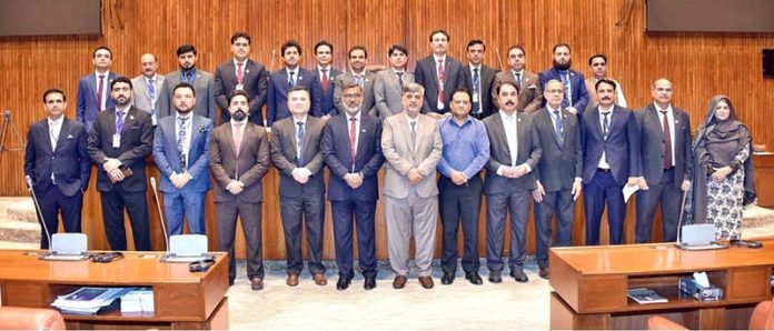 A group photograph of the participants of 43rd Mid-Career Management Course Organized by National Institute Of Public Administration, Quetta in the Senate Hall at Parliament House