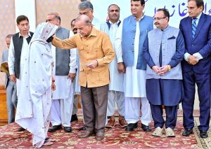 Prime Minister Muhammad Shehbaz Sharif distributing relief cheques amongst the families of martyred during Ma’arka-e-Haq