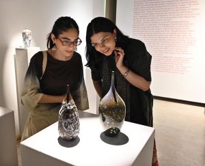 Visitors viewing 'Bowl Works' during the exhibition This is Not a Bowl by Sulaman Ikram, curated by Aasim Akhtar, at Khaas Gallery, IFWA