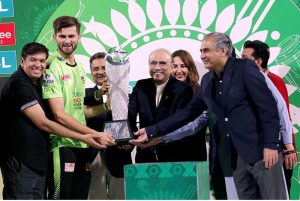 President of Pakistan, Asif Ali Zardari, presents the trophy to Lahore Qalandars' captain Shaheen Shah Afridi after their victory against Quetta Gladiators in the PSL-X T20 Final at Gaddafi Stadium.