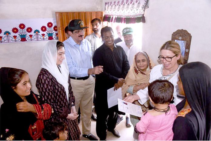 First Lady Aseefa Bhutto Zardari, Sindh Chief Minister Syed Murad Ali Shah, and World Bank Managing Director Ms. Anna Bjerde visit Nazar Mohammad Leghari village and interact with residents living in homes built under the Sindh Peoples Housing project for flood-affected families