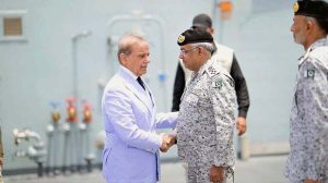 Prime Minister Muhammad Shehbaz Sharif being received by Naval Chief Admiral Naveed Ashraf upon his arrival at Naval Dockyard
