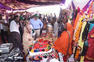 First Lady Aseefa Bhutto Zardari and World Bank Managing Director Ms. Anna Bjerde meet female members of the Village Reconstruction Committee (VRC), formed under the Sindh Peoples Housing Project (SPHP), as they display their handicrafts