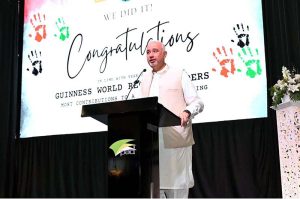 Ambassador Faisal Niaz Tirmizi, Pakistan’s Envoy to the UAE speaks during a landmark event at the Pakistan Association where the official announcement was made of a new Guinness World Record of the largest UAE flag created using human handprints by Pakistani Association Dubai