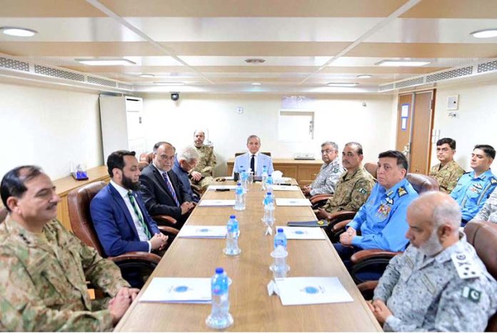 Prime Minister Muhammad Shehbaz Sharif being briefed by Commander Pakistan Fleet about Pakistan Navy's strategic orientation, operational preparedness and contributions during the ongoing operation, on board PNS TAIMUR at Naval Dockyard