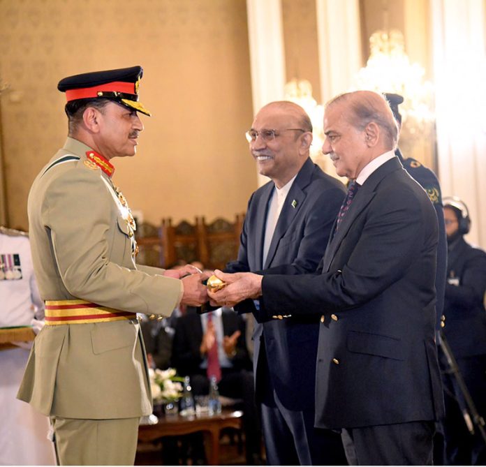President Asif Ali Zardari and Prime Minister Muhammad Shehbaz Sharif conferring the Batton of the Field Marshal upon the Chief of Army Staff, Field Marshal Syed Asim Munir NI(M), during a ceremony at Aiwan-e-Sadr