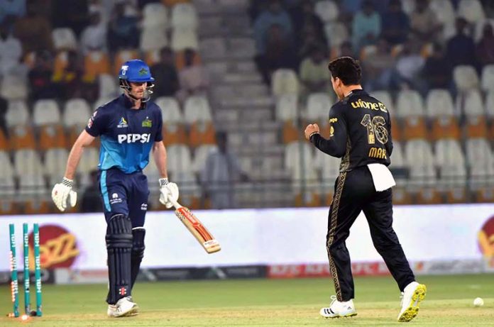 Peshawar Zalmi bowler Maaz Sadaqat celebrates after taking wicket of Multan Sultans batter Ashton Turner during the PSL-X T20 cricket match between Multan Sultans and Peshawar Zalmi at the Multan Cricket Stadium