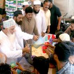 Businessman community serving free mango juice during the extreme hot weather and heat wave in city