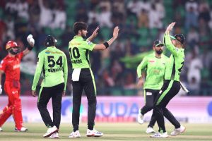 Lahore Qalanders players celebrate the wicket of Islamabad Uniteds’ Muhammad Shahzad bowled by Shaheen Shah Afridi during the Pakistan Super League PSL-X T20 cricket match between Lahore Qalanders and Islamabad United at the Gaddafi Cricket Stadium