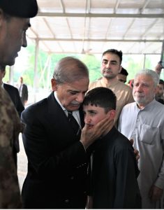 Prime Minister Muhammad Shehbaz Sharif consoles the family member of the seven-year-old Irtaza Abbas Turi, son of Lieutenant Colonel Zaheer Abbas Turi, who was martyred in Dawarandi, Azad Jammu & Kashmir, due to India's missile strike. The funeral was held at H-8 graveyard