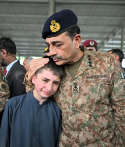 General Syed Asim Munir, NI (M), Chief of Army Staff (COAS) consoles the family member of the seven-year-old Irtaza Abbas Turi, son of Lieutenant Colonel Zaheer Abbas Turi, who was martyred in Dawarandi, Azad Jammu & Kashmir, due to India's missile strike. The funeral was held at H-8 graveyard