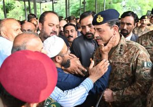 General Syed Asim Munir, NI (M), Chief of Army Staff (COAS) consoles the family member of the seven-year-old Irtaza Abbas Turi, son of Lieutenant Colonel Zaheer Abbas Turi, who was martyred in Dawarandi, Azad Jammu & Kashmir, due to India's missile strike. The funeral was held at H-8 graveyard